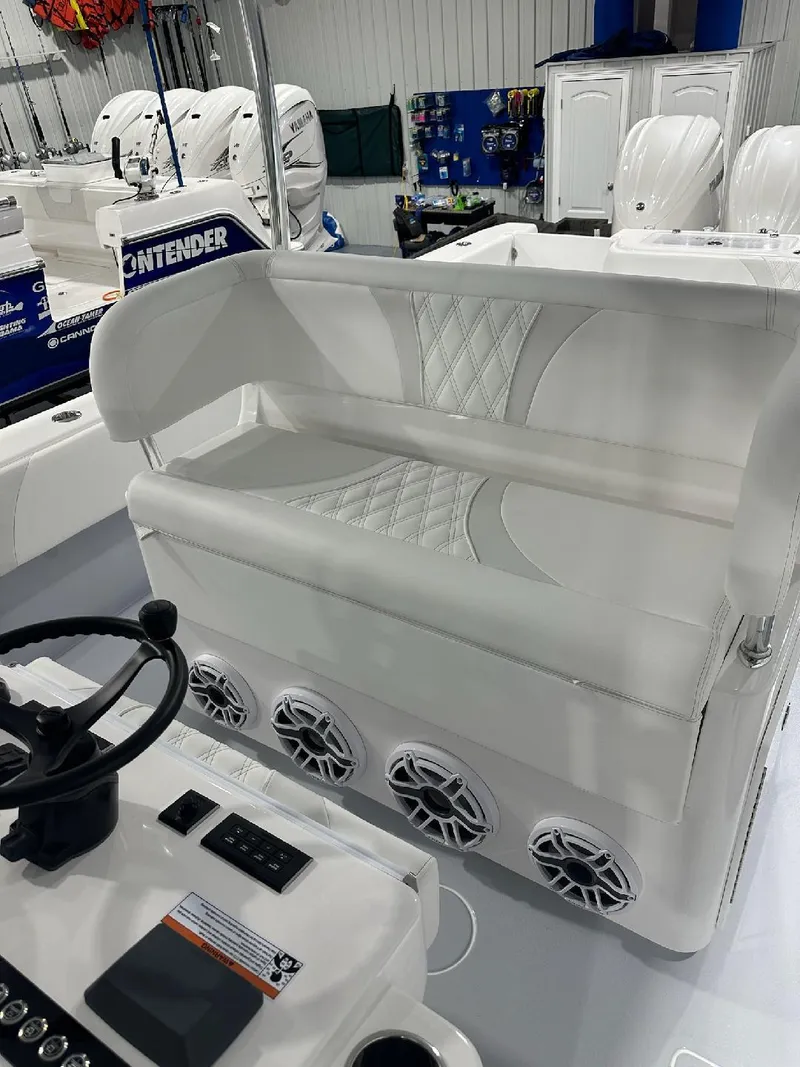 Slide: The Image of 2024 Contender 39 ST boat interior with seating and control panel. - 10