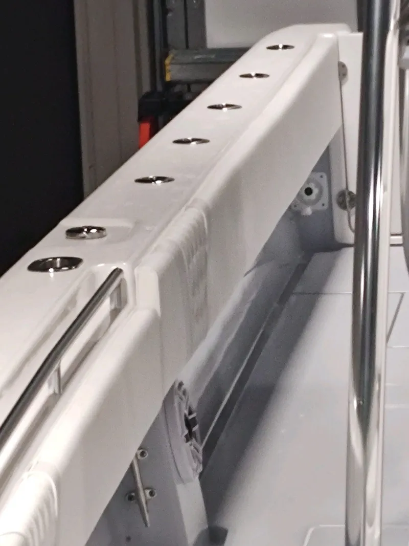 Slide: The Image of 2024 Contender 39 ST boat interior with rod holders and sleek design. - 13