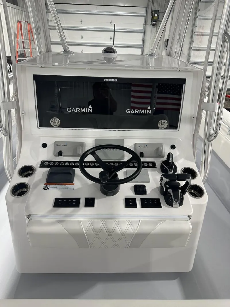 Slide: The Image of 2024 Contender 39 ST boat dashboard with Garmin navigation system. - 4