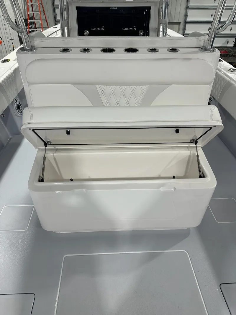 Slide: The Image of 2024 Contender 39 ST boat with open storage compartment on deck. - 7