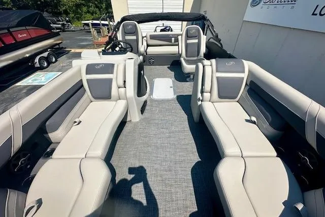 Slide: The Image of 2025 Barletta C22UC pontoon boat interior with spacious seating and modern design. - 17