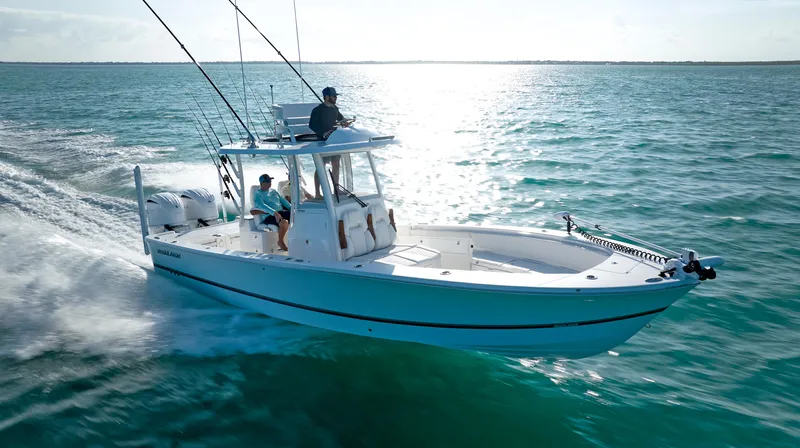 The Image of 2026 Regulator 30XO boat cruising on open water under clear skies. - 0