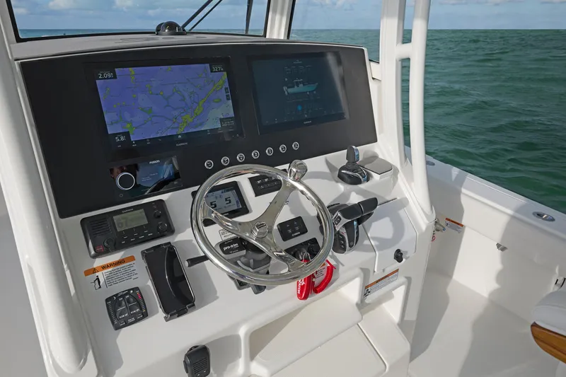 Slide: The Image of 2026 Regulator 30XO boat dashboard with advanced navigation and control systems. - 2