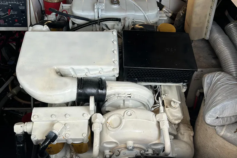 Slide: The Image of Engine compartment of a 2000 Tiara Yachts 3700 Open, showcasing mechanical components. - 13