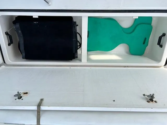 Slide: The Image of Storage compartment on a 2000 Tiara Yachts 3700 Open boat with equipment inside. - 21