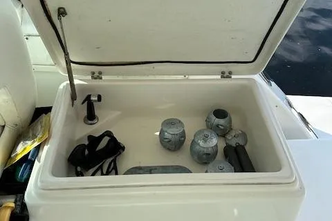 Slide: The Image of Open storage compartment on 2000 Tiara Yachts 3700 Open with weights and gear. - 23