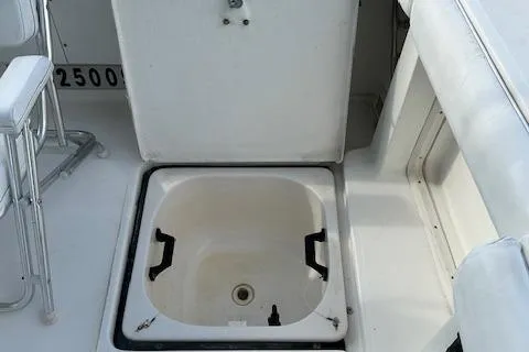 Slide: The Image of Tiara Yachts 3700 Open 2000 model, open storage compartment on deck. - 24