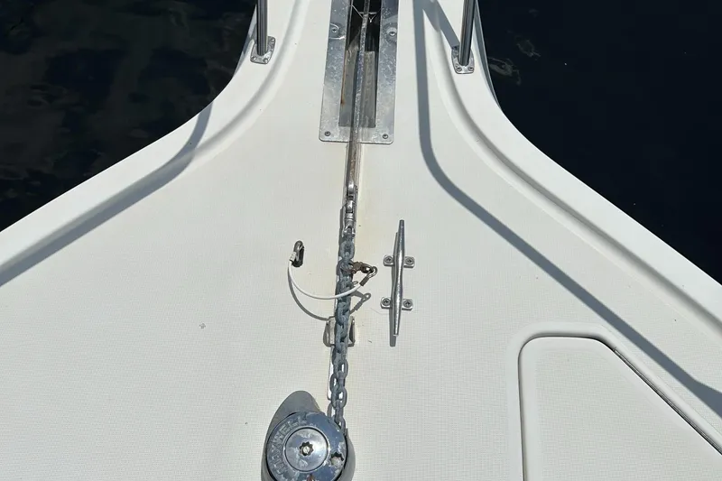Slide: The Image of Bow of 2000 Tiara Yachts 3700 Open with anchor chain and cleat. - 26