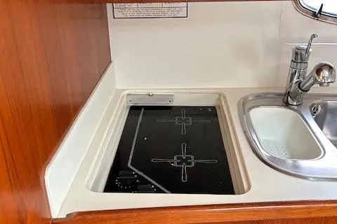 Slide: The Image of Tiara Yachts 3700 Open 2000 model kitchen with stove and sink. - 33