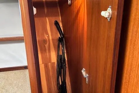 Slide: The Image of Wooden interior storage cabinet on a 2000 Tiara Yachts 3700 Open. - 34