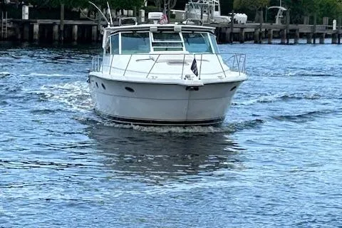 Slide: The Image of 2000 Tiara Yachts 3700 Open cruising on a calm waterway. - 4