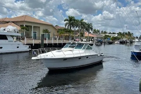 Slide: The Image of Tiara Yachts 3700 Open 2000 model cruising in a scenic marina. - 5