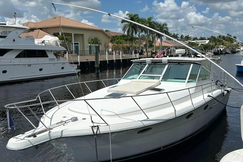 Slide: The Image of 2000 Tiara Yachts 3700 Open docked in a sunny marina. - 6