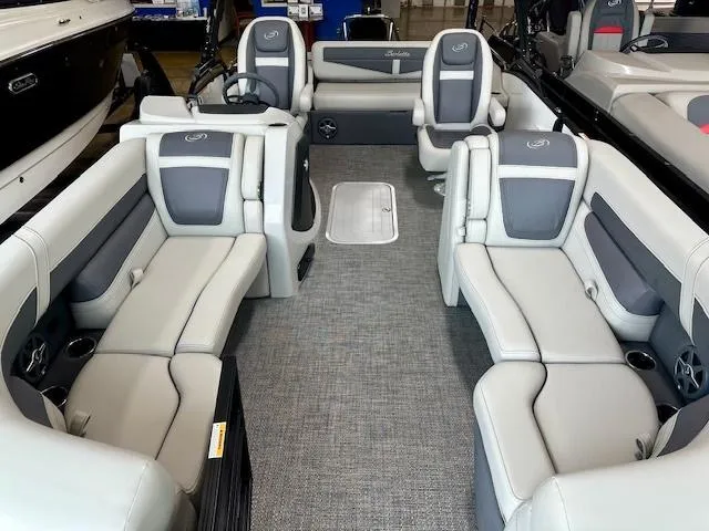 Slide: The Image of 2025 Barletta C22UC pontoon boat interior with gray seating and modern design. - 2