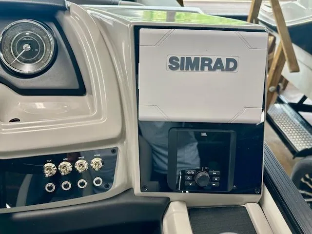 Slide: The Image of 2025 Barletta C22UC dashboard featuring Simrad navigation system and control panel. - 5