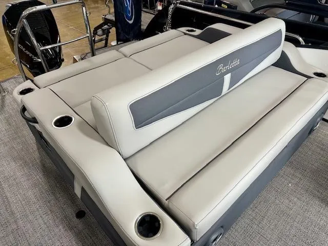 Slide: The Image of 2025 Barletta C22UC boat seating with cup holders and sleek design. - 6