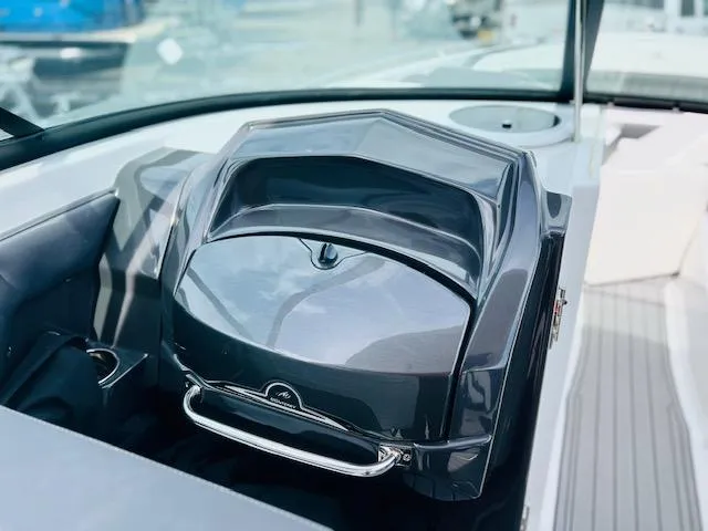 Slide: The Image of 2019 Monterey 298 Super Sport boat dashboard with sleek design and modern controls. - 10