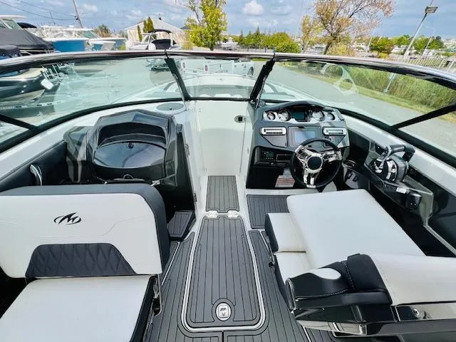 Slide: The Image of 2019 Monterey 298 Super Sport boat interior with sleek design and modern dashboard. - 14
