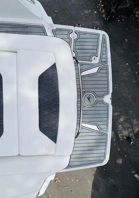 Slide: The Image of 2019 Monterey 298 Super Sport boat deck with cushioned seating and textured flooring. - 16