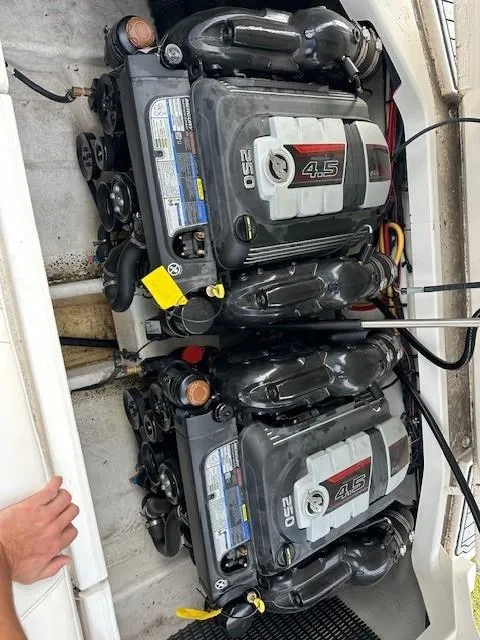 Slide: The Image of Twin engines in a 2019 Monterey 298 Super Sport boat. - 19