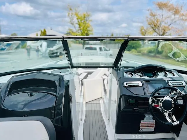 Slide: The Image of 2019 Monterey 298 Super Sport boat interior with steering wheel and dashboard view. - 3