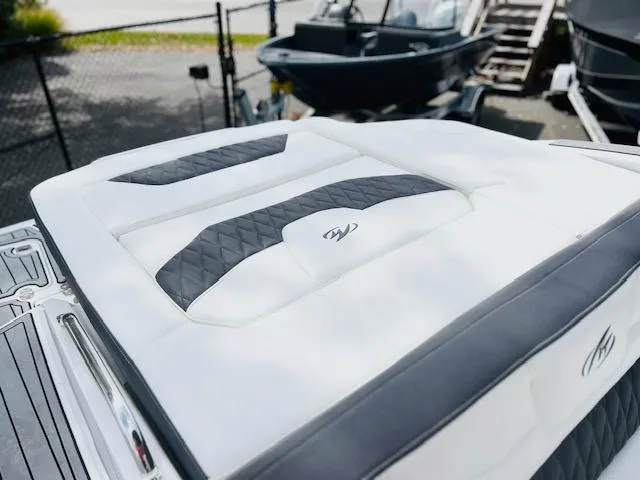 Slide: The Image of 2019 Monterey 298 Super Sport boat with sleek white and black seating. - 4