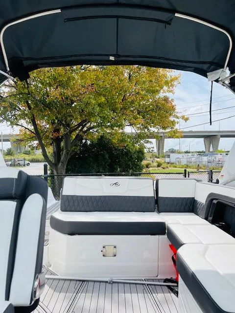 Slide: The Image of Interior of 2019 Monterey 298 Super Sport boat with seating and canopy. - 5