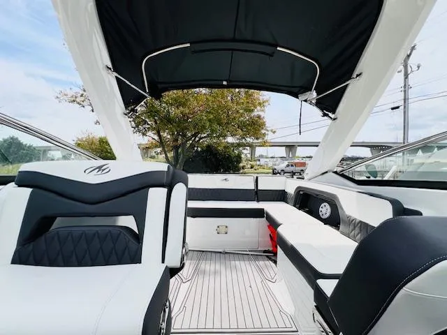 Slide: The Image of 2019 Monterey 298 Super Sport boat interior with sleek seating and canopy. - 6