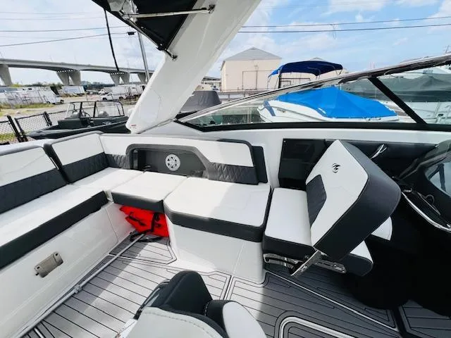 Slide: The Image of 2019 Monterey 298 Super Sport boat interior with sleek seating and modern design. - 9