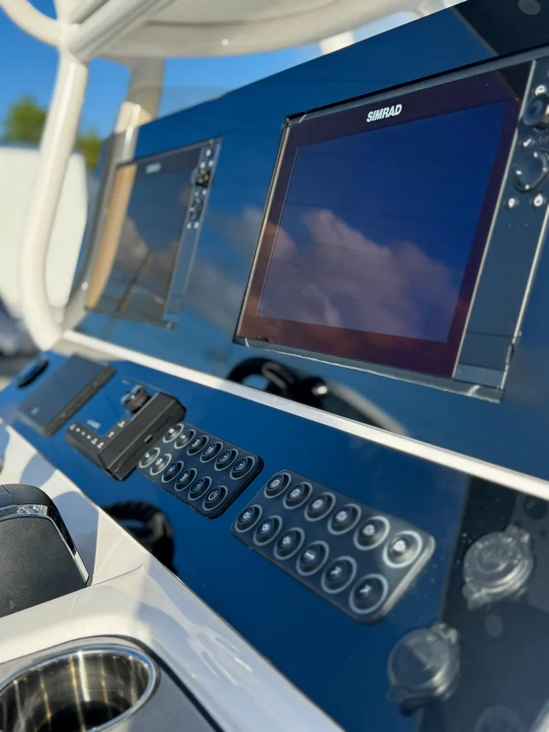 Slide: The Image of 2025 Blazer 2700 HYBRID BAY boat dashboard with advanced navigation system and controls. - 4