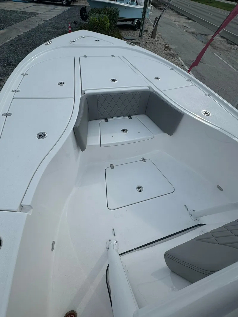 Slide: The Image of 2025 Blazer 2700 HYBRID BAY boat interior with storage compartments and seating. - 6