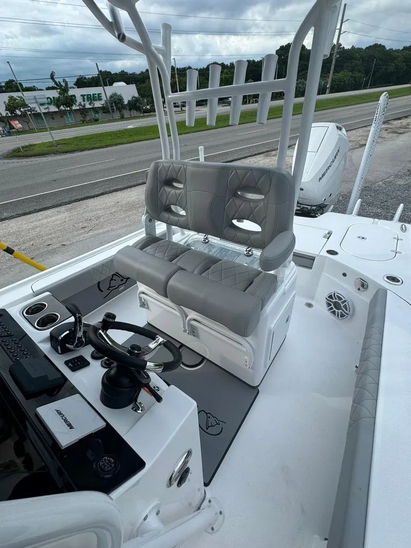 Slide: The Image of 2025 Blazer 2700 Hybrid Bay boat interior with tower and dual seating. - 9