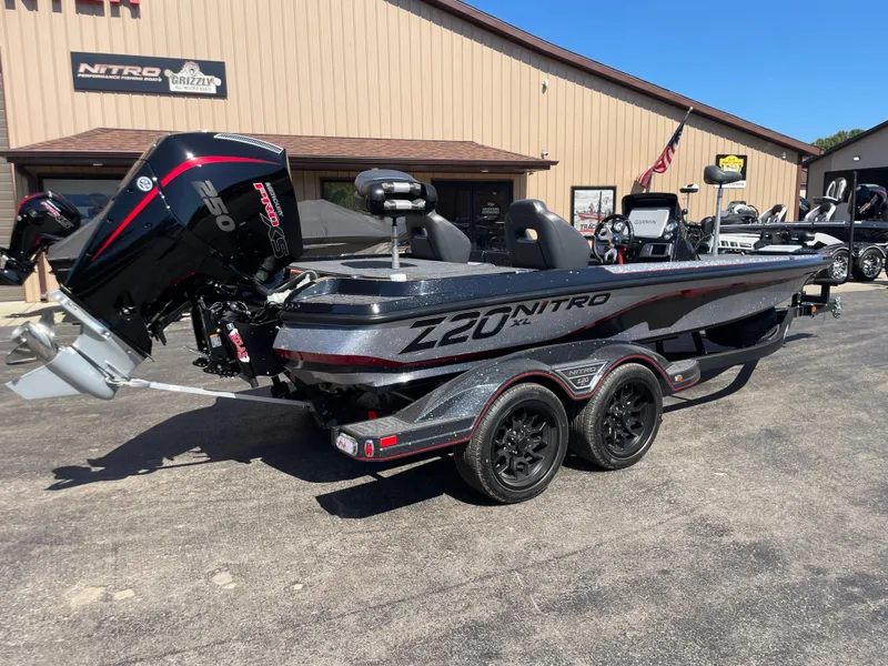 Slide: The Image of 2025 Nitro Z20 XL Pro boat with powerful engine, parked outdoors. - 5