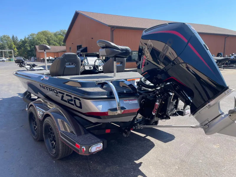 Slide: The Image of 2025 Nitro Z20 XL Pro boat with powerful outboard motor in a sunny outdoor setting. - 6