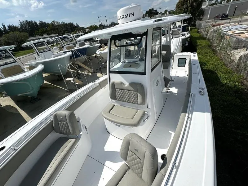 Slide: The Image of 2025 Sportsman Open 282 boat with sleek design and comfortable seating. - 11