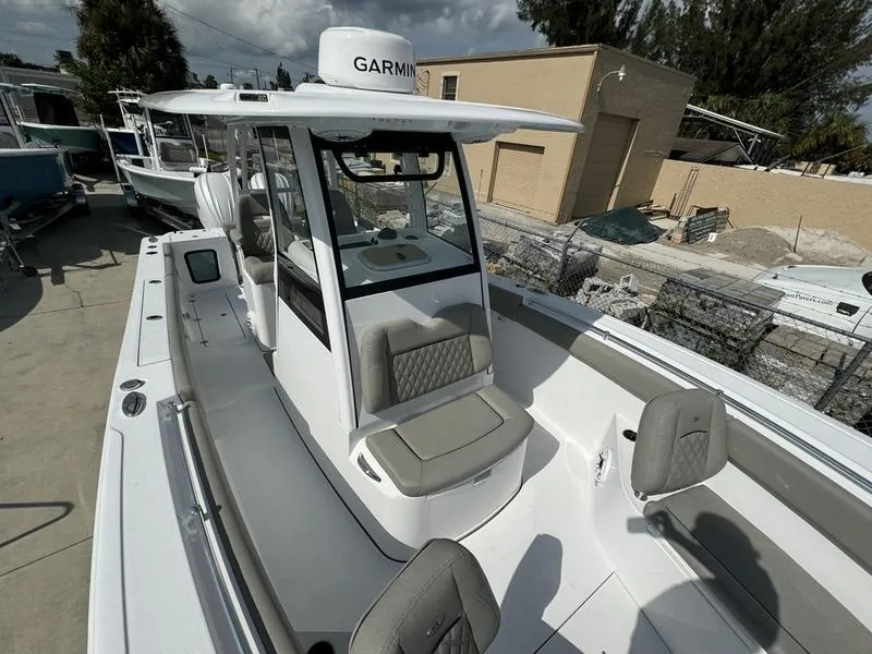 Slide: The Image of 2025 Sportsman Open 282 boat with Garmin equipment, docked outdoors. - 12