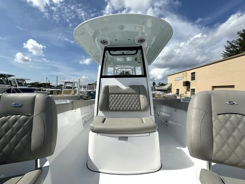 Slide: The Image of 2025 Sportsman Open 282 boat interior with cushioned seating and modern design. - 14