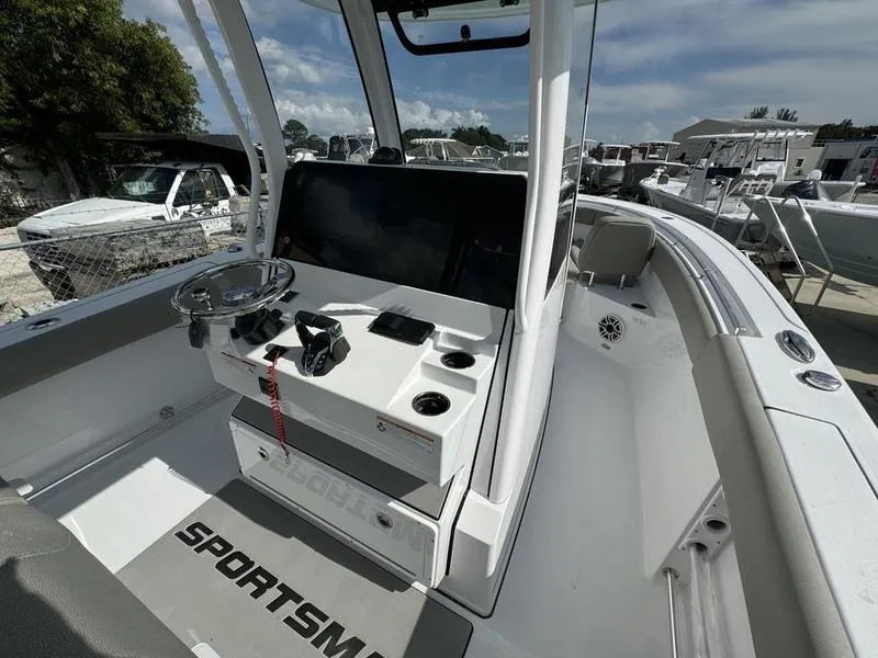 Slide: The Image of 2025 Sportsman Open 282 boat interior with steering console and seating. - 24