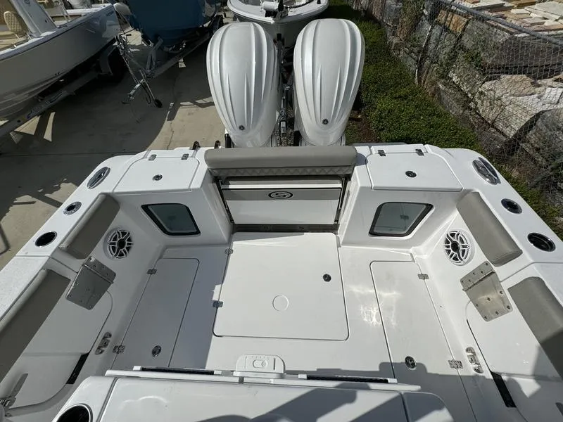 Slide: The Image of 2025 Sportsman Open 282 boat deck with dual engines and spacious seating. - 28