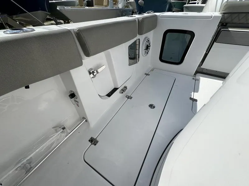 Slide: The Image of 2025 Sportsman Open 282 boat interior with sleek seating and storage. - 39