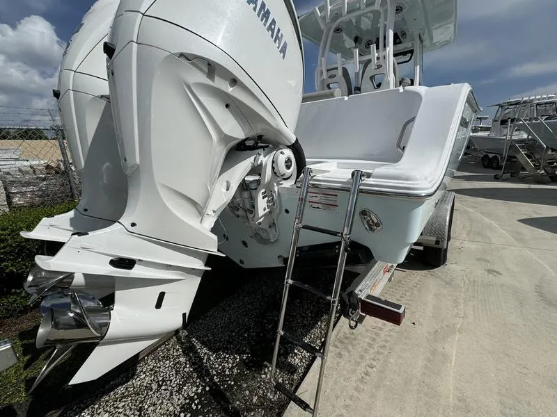 Slide: The Image of 2025 Sportsman Open 282 boat with Yamaha outboard motor and ladder. - 4