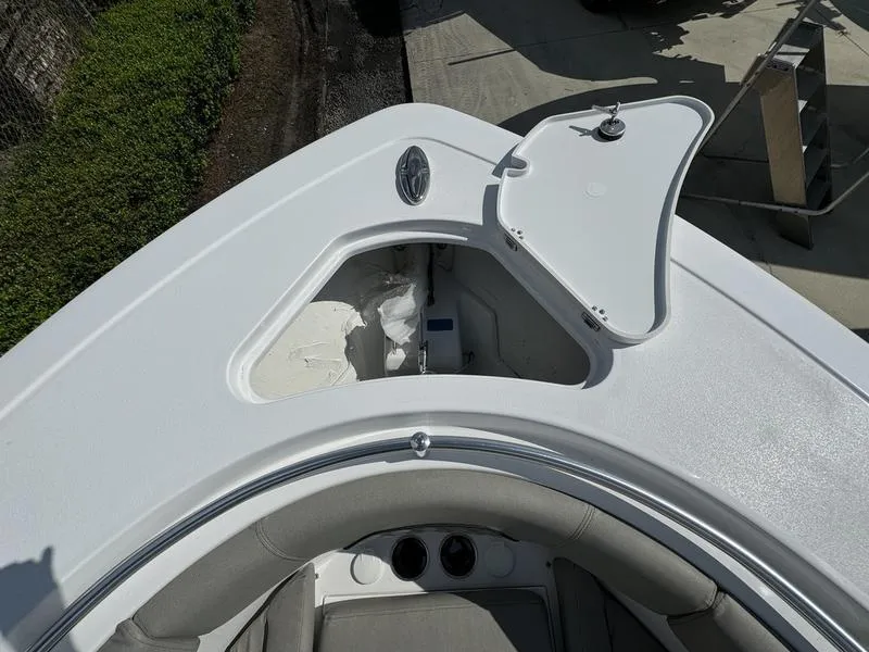 Slide: The Image of 2025 Sportsman Open 282 boat bow with open storage compartment. - 8