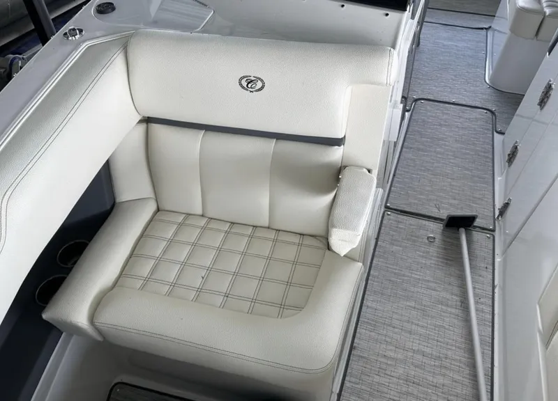Slide: The Image of 2022 Cobalt R30 boat interior with white cushioned seating and modern design. - 10