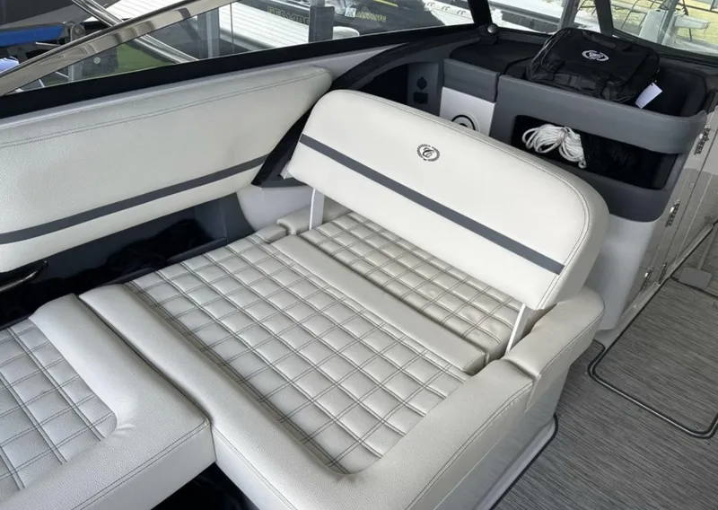Slide: The Image of Interior of 2022 Cobalt R30 boat with white cushioned seating. - 14