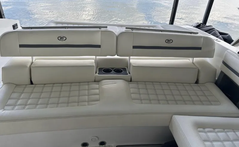 Slide: The Image of Luxurious seating on 2022 Cobalt R30 boat with quilted upholstery and cup holders. - 15