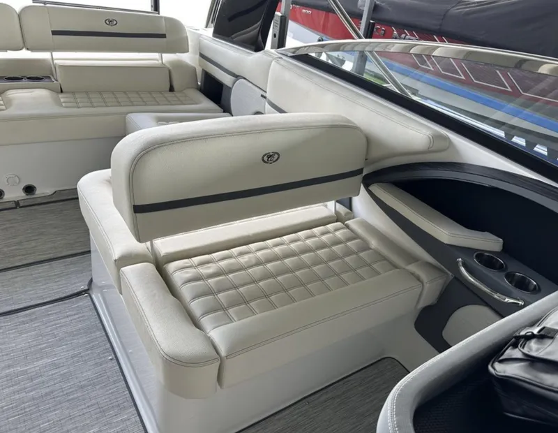 Slide: The Image of 2022 Cobalt R30 boat interior with luxurious seating and cup holders. - 16