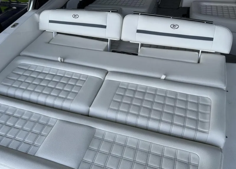 Slide: The Image of Luxurious seating on 2022 Cobalt R30 boat with quilted white upholstery. - 19