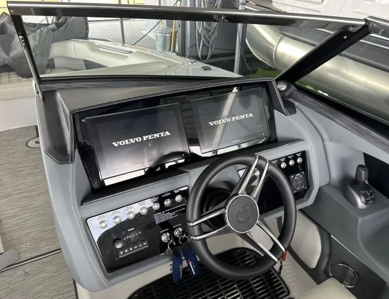 Slide: The Image of 2022 Cobalt R30 boat dashboard with dual Volvo Penta displays and steering wheel. - 3