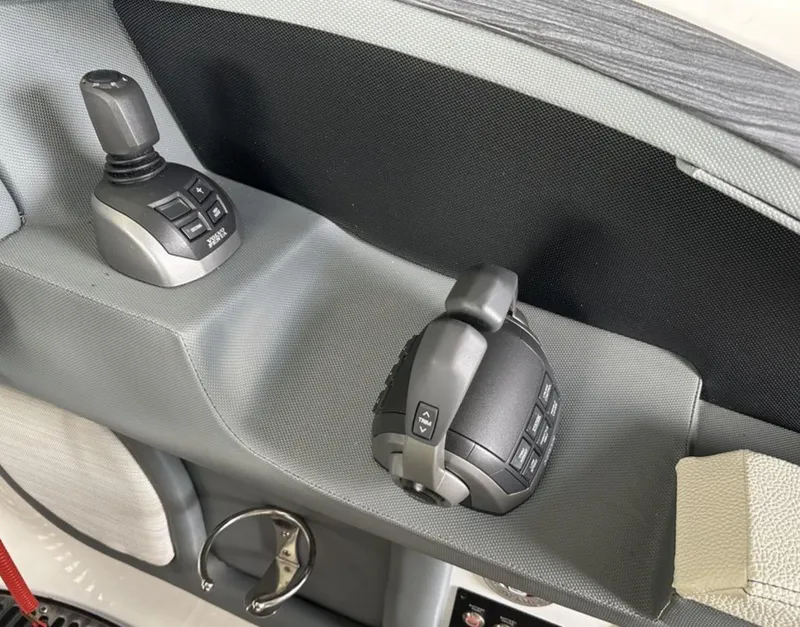 Slide: The Image of 2022 Cobalt R30 boat controls with joystick and throttle. - 8