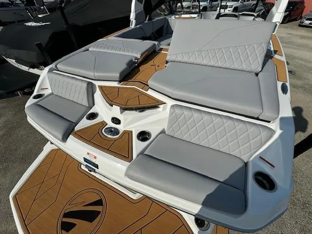 Slide: The Image of 2025 Tigé Z1 boat interior with gray seating and modern design elements. - 12